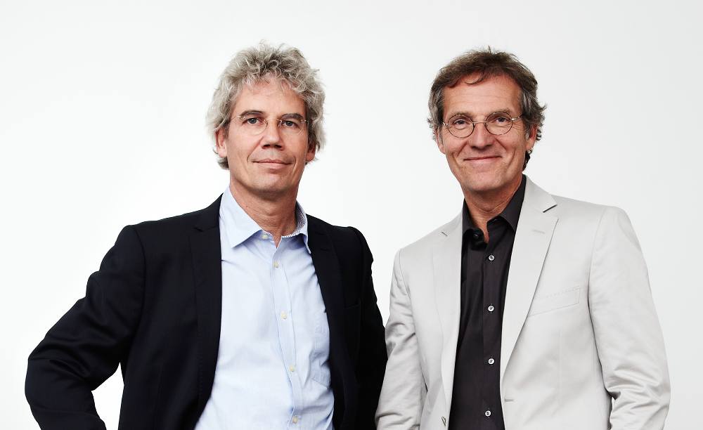 Till Schneider (links) und Michael Schumacher.